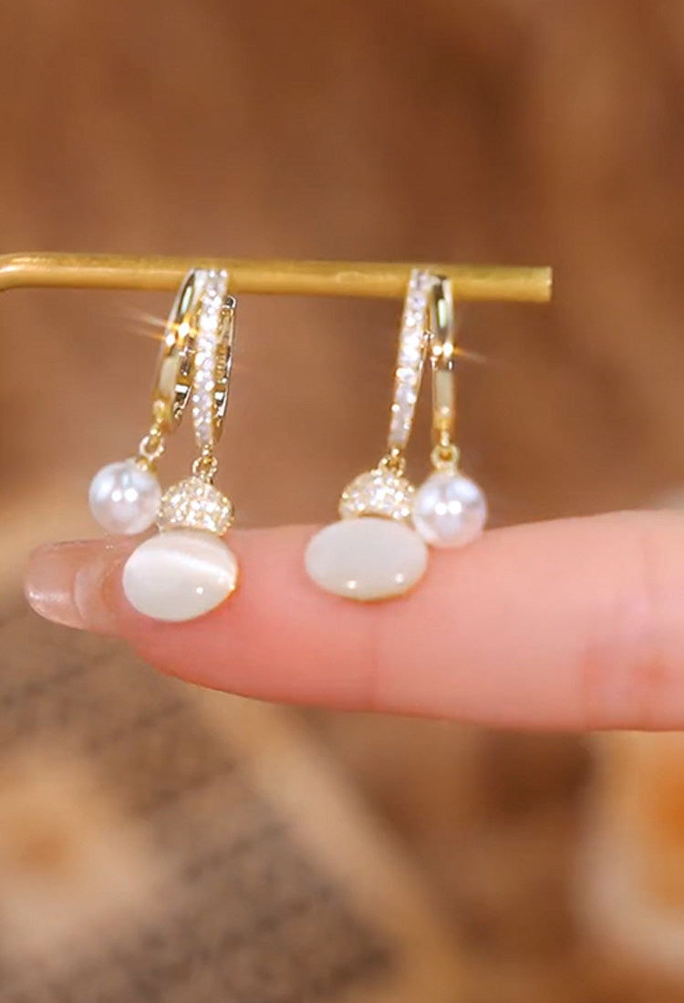 Pendientes de perlas de calabaza con ojo de gato para mujer