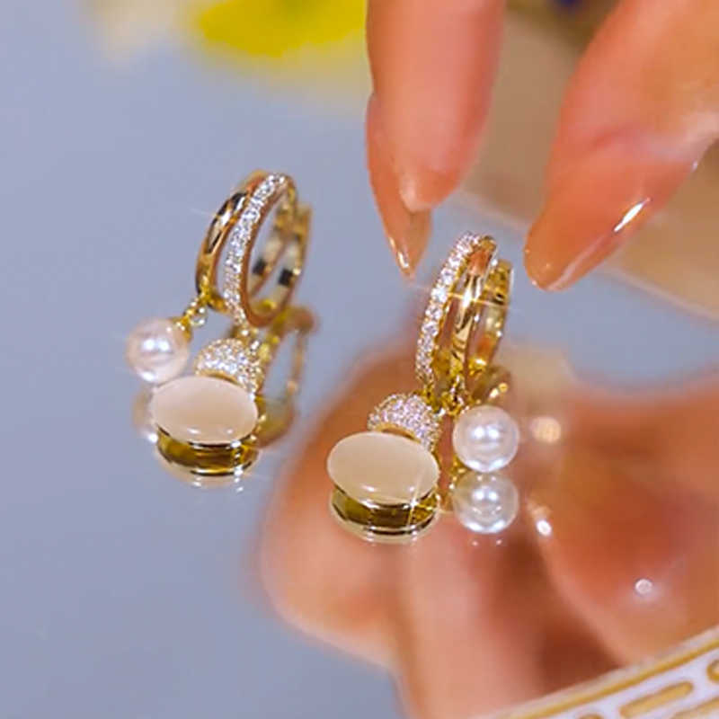 Pendientes de perlas de calabaza con ojo de gato para mujer