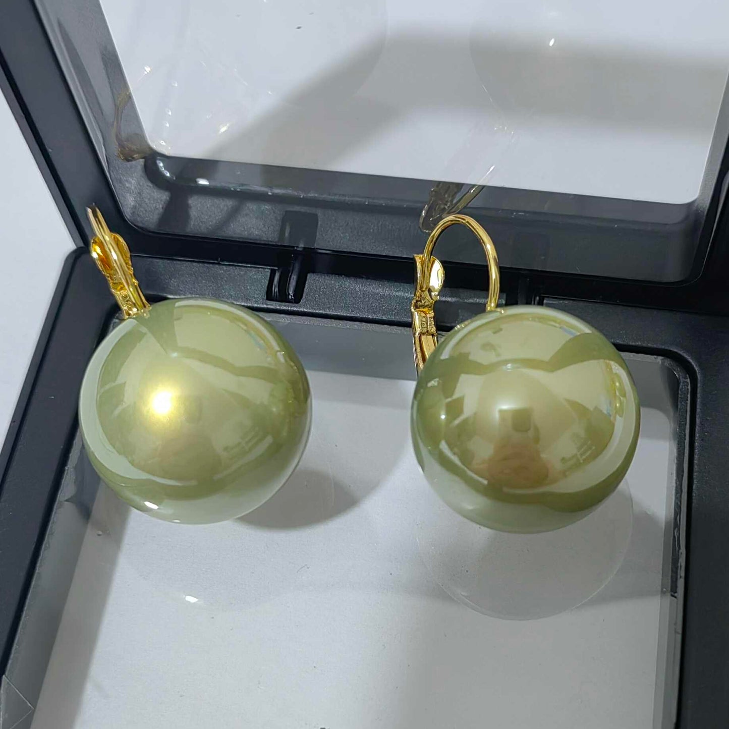 Retro-Style Green Pearl Earrings with a Unique Design