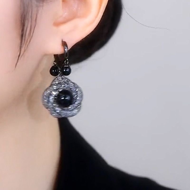 The Enchanting Black Flower Earrings Exude Sophistication