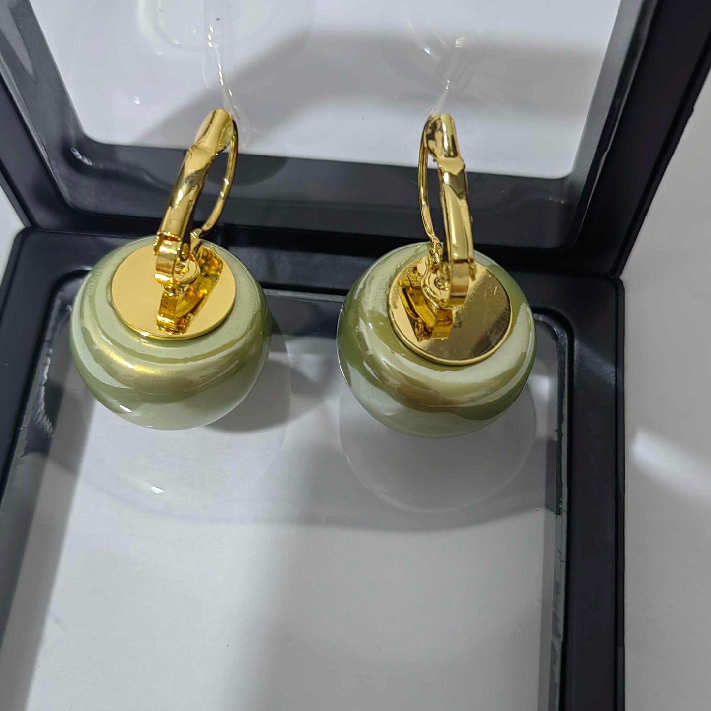 Retro-Style Green Pearl Earrings with a Unique Design