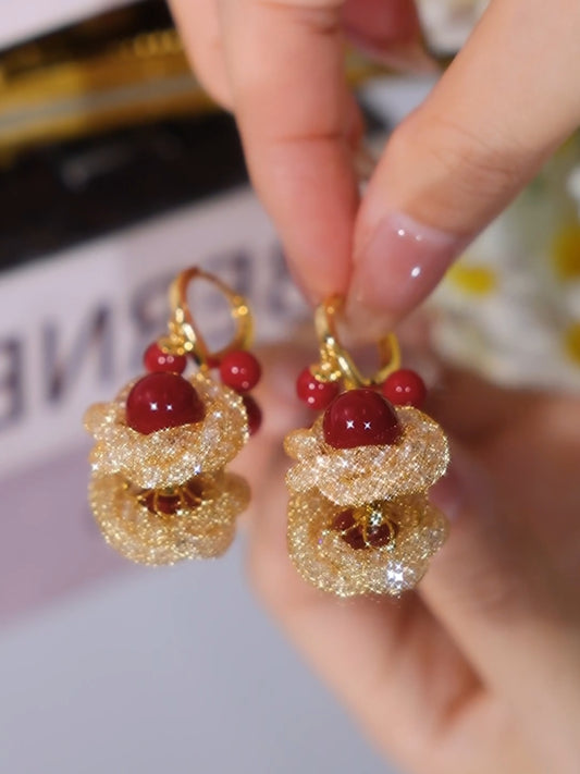Pendientes de malla de belleza con perlas rojas