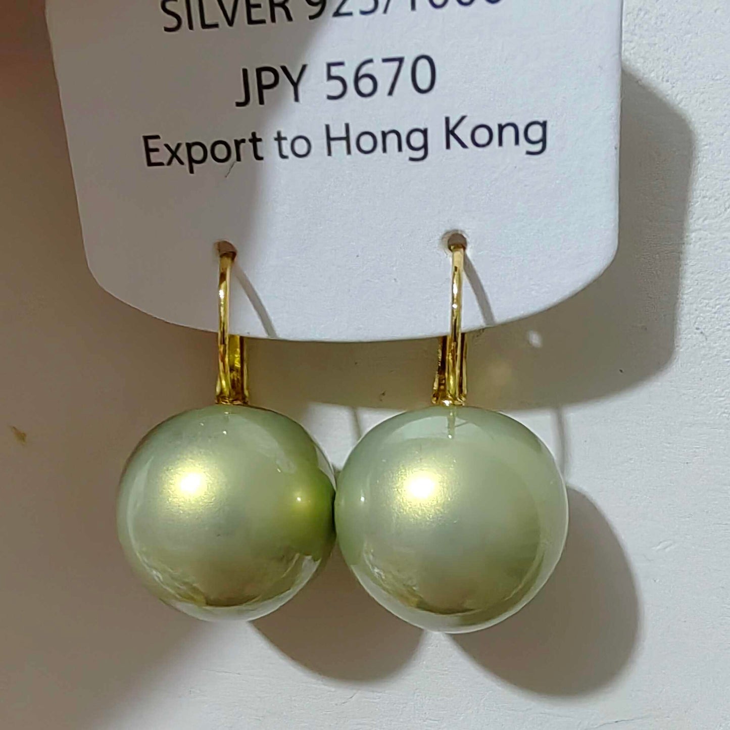 Retro-Style Green Pearl Earrings with a Unique Design