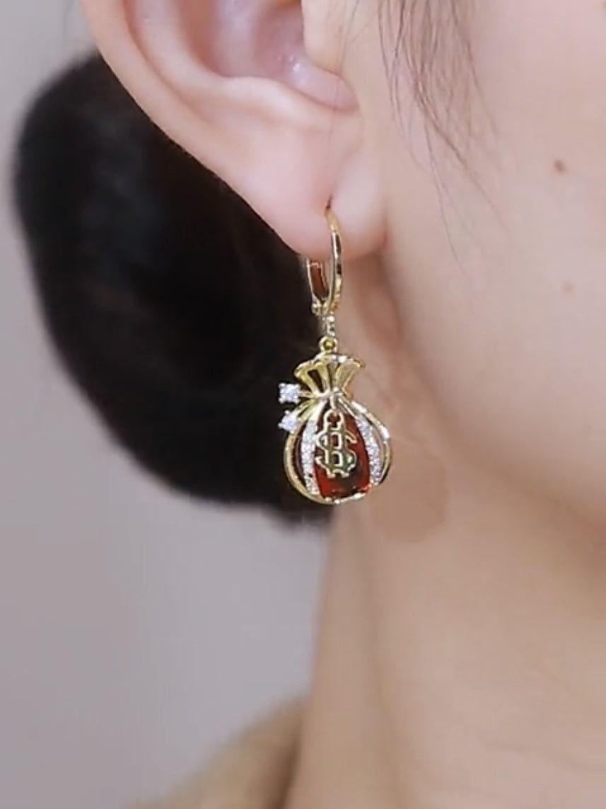 Nuevos pendientes de bolsa de dinero con forma de ojo de gato Pendientes con personalidad para mujer